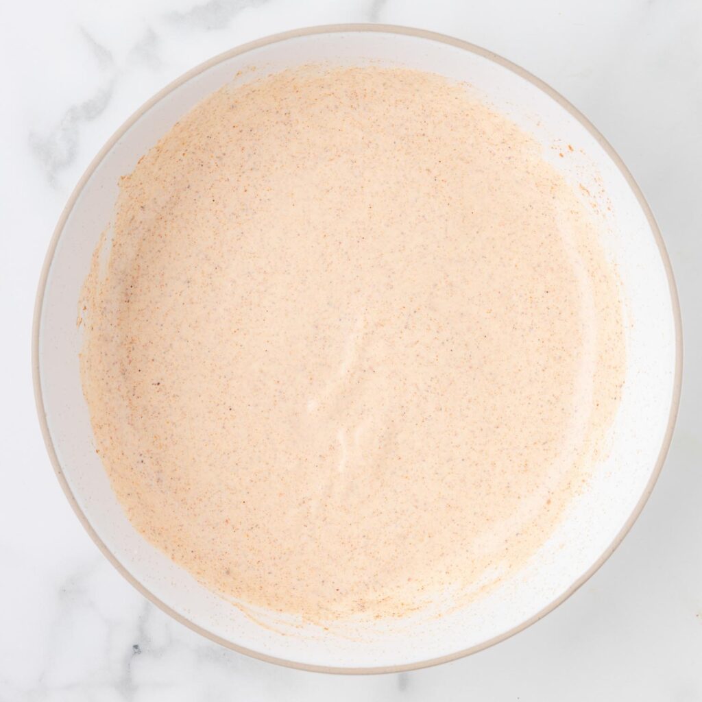 mexi-ranch dressing for fiesta lime chicken in a small white bowl.