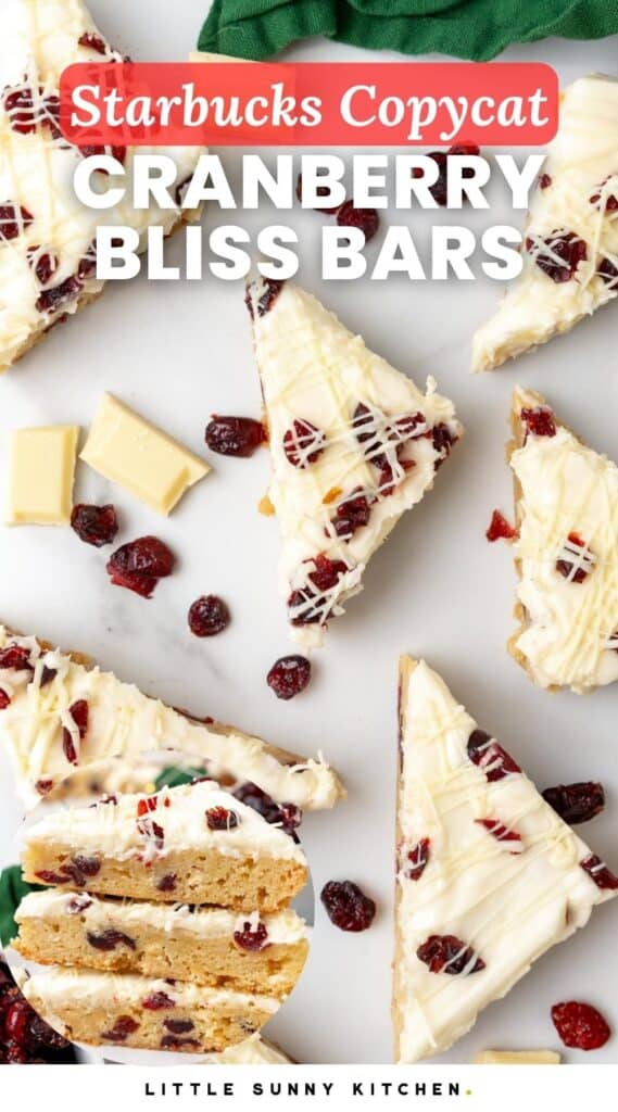 triangular pieces of cranberry bars topped with frosting and white chocolate drizzle. Text overlay says 